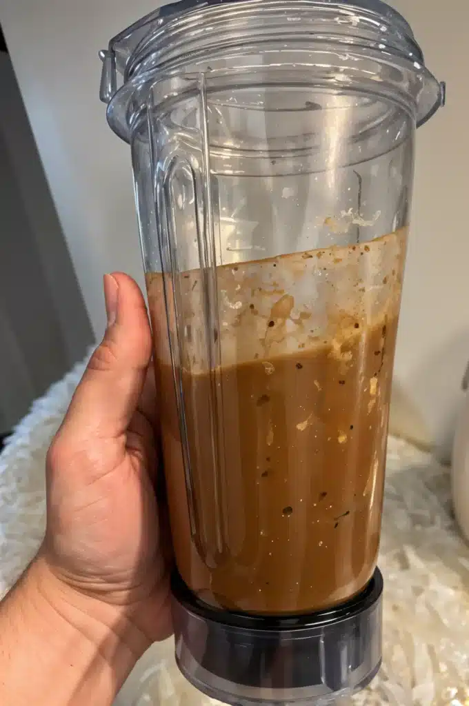 Skinny Proffee Coffee – High-Protein, Dairy-Free, and Budget-Friendly 2 Blending skinny proffee coffee in a blender bottle.