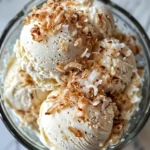 Ultimate Dairy-Free Dessert Recipes (No-Bake, Creamy, & Kid-Friendly) 6 Creamy coconut milk ice cream scoops in a bowl.