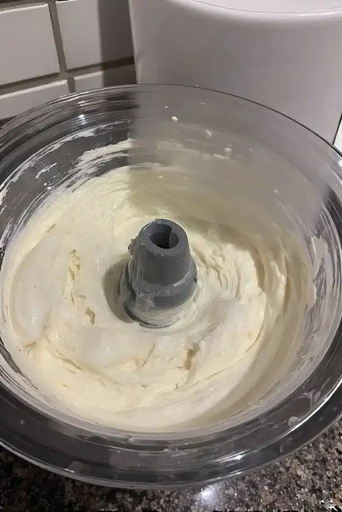 Creamy Vanilla Dairy-Free Ice Cream – Budget-Friendly Healthy Dessert 2 Vanilla dairy-free ice cream churning in ice cream machine