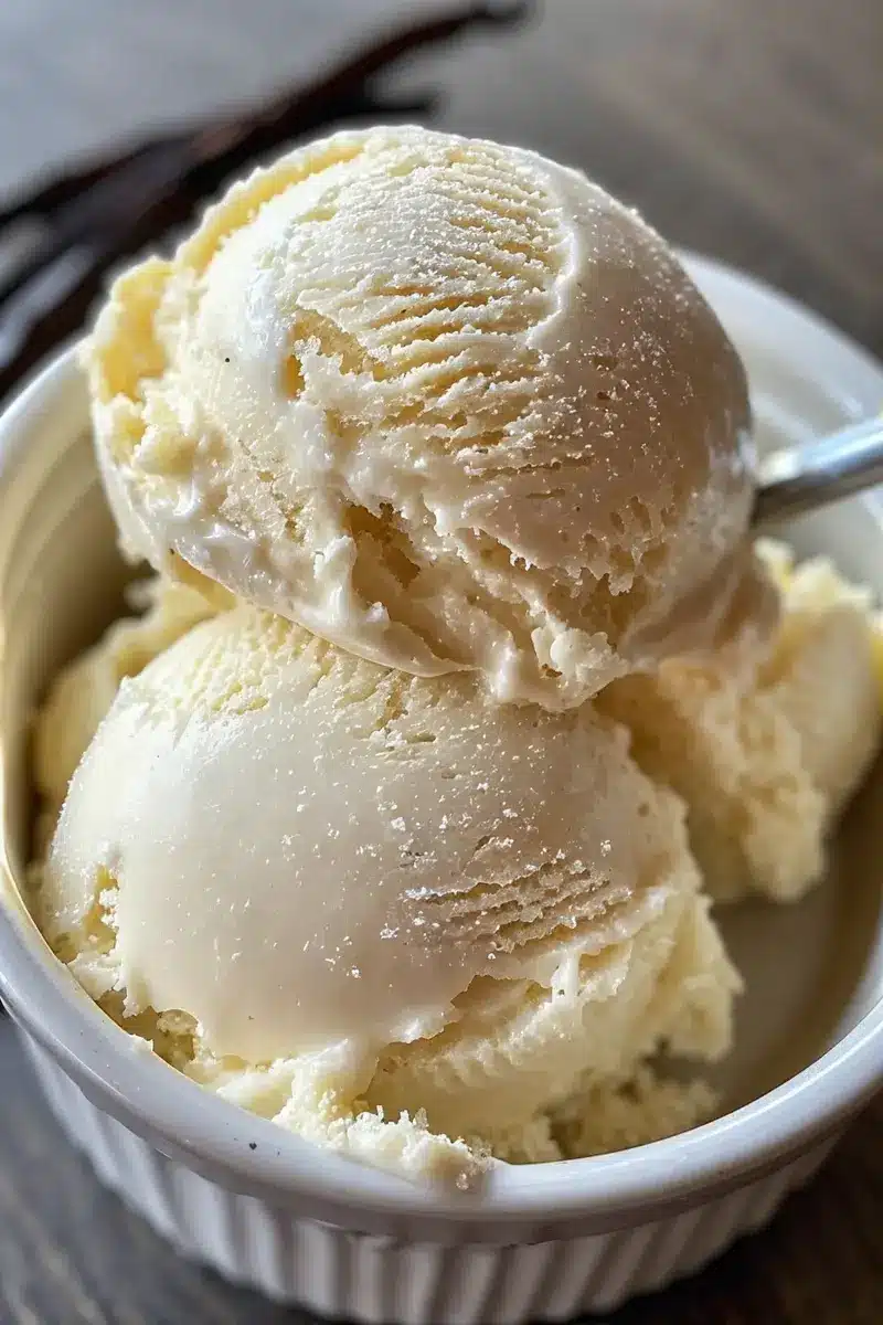 Creamy Vanilla Dairy-Free Ice Cream – Budget-Friendly Healthy Dessert 5 Scoop of vanilla dairy-free ice cream in bowl with soft texture