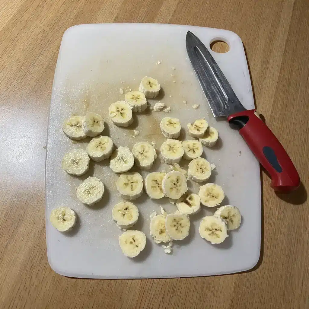 Frozen Banana Bites (Dairy-Free & Nut-Free Snack Idea) 3 Slicing bananas into rounds for frozen banana bites